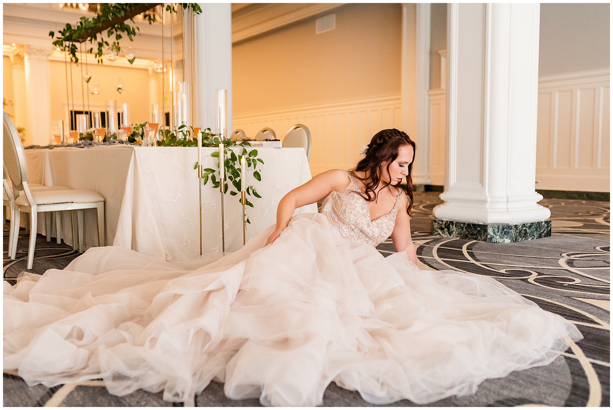 A bride poses on the floor of the ballroom in the Virginian Hotel