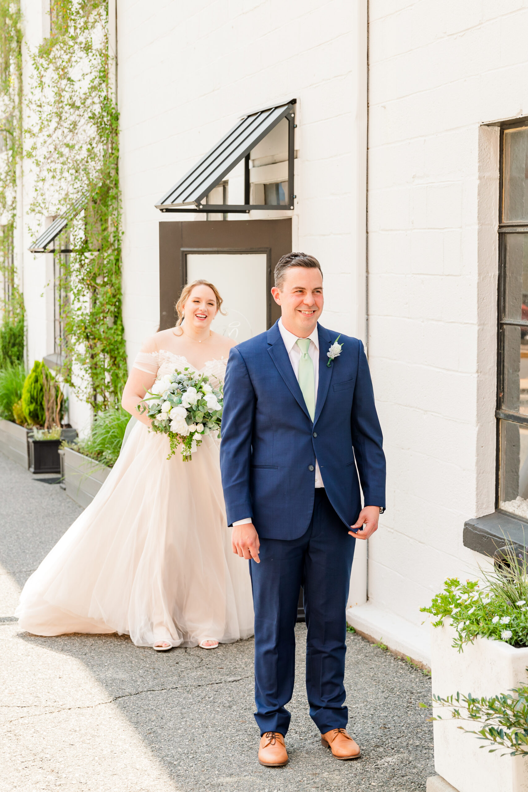 A bride and groom embrace in downtown Culpeper